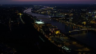 AX108_194E - 4K aerial stock footage of bridges spanning the Monongahela River, Downtown Pittsburgh, Pennsylvania, night