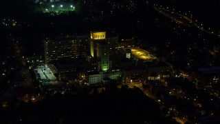 AX108_214 - 4K stock footage aerial video orbiting Allegheny General Hospital, Pittsburgh, night