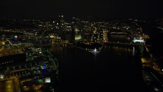 AX108_233E - 4K aerial stock footage of Point State Park and Downtown Pittsburgh, Pennsylvania, night