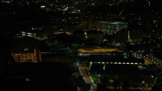 AX108_240E - 4K aerial stock footage approaching VA Pittsburgh Healthcare System, Pittsburgh, night
