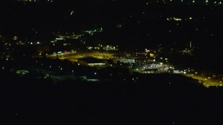 AX108_261 - 4K aerial stock footage of a shopping enter, Penn Hills, Pennsylvania, night