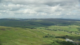 AX109_005 - 5.5K stock footage aerial video of windmills and farms, Denny, Scotland