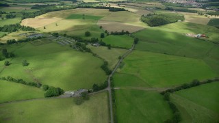 AX109_010E - 5.5K aerial stock footage fly over farms and farmland; Stirling, Scotland