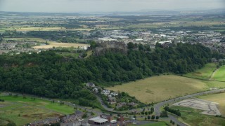AX109_022E - 5.5K aerial stock footage approach and tilt to castle grounds of Stirling Castle, Scotland