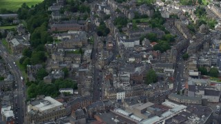 AX109_031E - 5.5K aerial stock footage fly over residential buildings along King Street, church and Stirling Castle in Stirling, Scotland