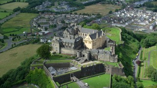 AX109_035 - 5.5K stock footage aerial video approach Stirling Castle in Scotland