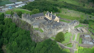 AX109_039 - 5.5K stock footage aerial video orbiting historic Stirling Castle, Scotland