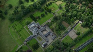AX109_060 - 5.5K stock footage aerial video of Keir House surrounded by trees, Scotland