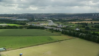 AX109_122E - 5.5K aerial stock footage of The Kelpies sculptures and M9 highway, Falkirk, Scotland