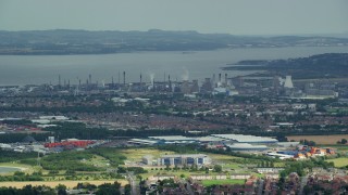 AX109_149 - 5.5K aerial stock footage of a natural gas power plant along the water, Falkirk, Scotland