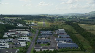 AX109_175E - 5.5K aerial stock footage approach Cumbernauld Airport Runway, Scotland