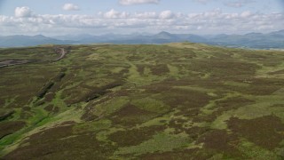 AX110_024 - 5.5K aerial stock footage approach Carleatheran and fly over Gargunnock Hills, Scotland
