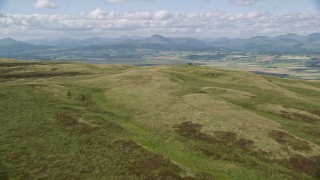 AX110_026 - 5.5K aerial stock footage approach Carleatheran from the Gargunnock Hills, Scotland