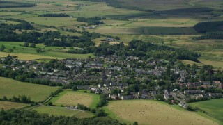 AX110_031E - 5.5K aerial stock footage of an orbit of the Scottish village of Kippen, Scotland
