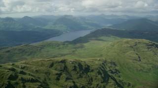 AX110_054 - 5.5K aerial stock footage approach Loch Lomond and mountains, Scottish Highlands, Scotland