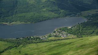 AX110_066E - 5.5K aerial stock footage of a village on the shore of Loch Long, Arrochar, Scottish Highlands, Scotland