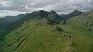 AX110_070 - 5.5K aerial stock footage approach a green mountain, The Cobbler, Scottish Highlands, Scotland