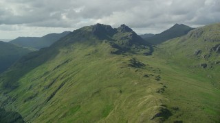 AX110_070E - 5.5K aerial stock footage of The Cobbler, a green mountain peak, Scottish Highlands, Scotland