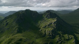 AX110_073 - 5.5K stock footage aerial video of The Cobbler, a green mountain peak, Scottish Highlands, Scotland