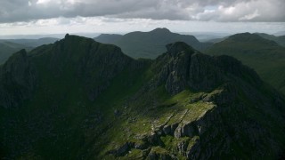 AX110_074 - 5.5K aerial stock footage of The Cobbler, a green mountain peak, Scottish Highlands, Scotland