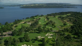 AX110_116E - 5.5K aerial stock footage of an orbit of Loch Lomond Golf Course, Luss, Scottish Highlands, Scotland