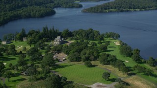 AX110_119E - 5.5K aerial stock footage of Rossdhu Mansion at Loch Lomond Golf Course, Luss, Scottish Highlands, Scotland