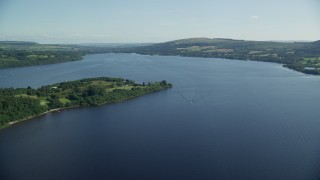AX110_122E - 5.5K aerial stock footage fly over Loch Lomond, Scottish Highlands, Scotland
