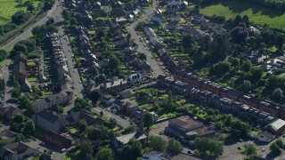AX110_134 - 5.5K aerial stock footage of homes and apartment buildings, Alexandria, Scotland