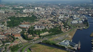 AX110_154E - 5.5K aerial stock footage of approaching city buildings in Glasgow, Scotland