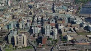 AX110_157 - 5.5K aerial stock footage of approach city office buildings in Glasgow, Scotland