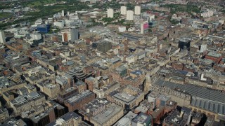 AX110_159 - 5.5K aerial stock footage of passing city buildings, Glasgow, Scotland