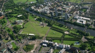 AX110_161 - 5.5K stock footage aerial video of monument and museum at Glasgow Green park by River Clyde, Scotland