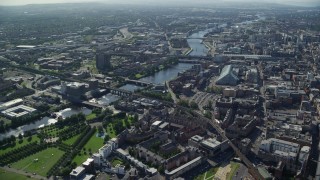 AX110_162E - 5.5K aerial stock footage of the River Clyde with bridges among city buildings, Glasgow, Scotland