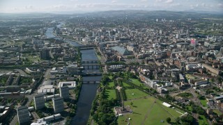 AX110_164 - 5.5K stock footage aerial video of the River Clyde with bridges among city buildings, Glasgow, Scotland