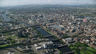 AX110_166 - 5.5K stock footage aerial video of River Clyde with bridges and the city of Glasgow, Scotland