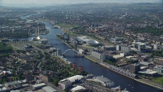 AX110_169E - 5.5K aerial stock footage of Scotland's National Arena and Clyde Auditorium across River Clyde, Glasgow, Scotland