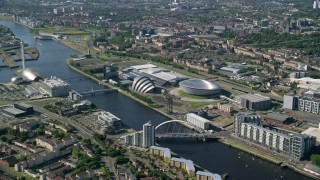AX110_170 - 5.5K stock footage aerial video of Scotland's National Arena and Clyde Auditorium beside River Clyde, Glasgow, Scotland