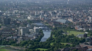 AX110_190 - 5.5K stock footage aerial video of city view with the River Clyde, Glasgow, Scotland