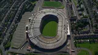 AX110_194 - 5.5K stock footage aerial video tilt to bird's eye view of the Hampden Park soccer stadium, Glasgow, Scotland