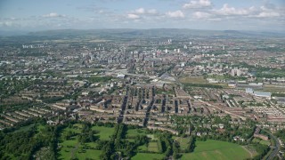 AX110_196 - 5.5K stock footage aerial video of a wide city view of Glasgow, Scotland