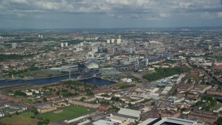 AX110_202E - 5.5K aerial stock footage approach River Clyde, arena and concert hall, Glasgow, Scotland