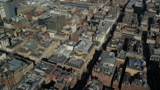 AX110_211 - 5.5K aerial stock footage fly over office buildings and city streets in Glasgow, Scotland