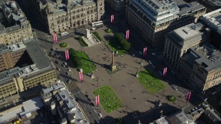 AX110_212 - 5.5K aerial stock footage of George Square and City Chambers, Glasgow, Scotland