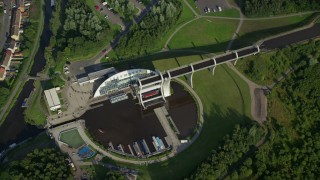 AX111_007 - 5.5K aerial stock footage of tilting to a bird's eye of the Falkirk Wheel boat lift, Scotland