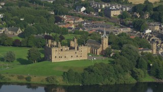 AX111_011E - 5.5K aerial stock footage of Linlithgow Palace and St. Michael's Parish Church, Scotland