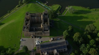 AX111_023 - 5.5K aerial stock footage tilt to bird's eye of Linlithgow Palace and St. Michael's Parish Church, Scotland