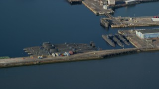 AX111_058 - 5.5K aerial stock footage of submarines at Rosyth Dockyard on Firth of Forth, Scotland