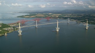AX111_061 - 5.5K aerial stock footage of Forth Road Bridge and Forth Bridge on Firth of Forth, Scotland