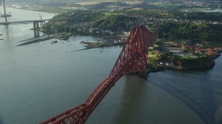 AX111_069E - 5.5K aerial stock footage of the Forth Bridge in North Queensferry, Scotland