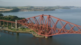 AX111_070 - 5.5K aerial stock footage of the Forth Bridge in North Queensferry, Scotland